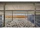 A spacious horse stall is shown with metal fencing offering good airflow and visibility at 1705 Outter Marker Rd, Castle Rock, CO 80108