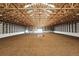 Spacious indoor horse riding arena with bright lighting, high ceiling and ample space for equestrian activities at 1705 Outter Marker Rd, Castle Rock, CO 80108