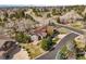 Expansive aerial shot of home nestled among mature trees in a desirable neighborhood with scenic roads at 7003 S Irvington Ct, Aurora, CO 80016