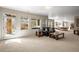 Open basement area with pool table, walkout access to the patio, and natural light at 7003 S Irvington Ct, Aurora, CO 80016
