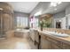A bathroom with dual sinks, shower, separate soaking tub and large vanity mirror at 7003 S Irvington Ct, Aurora, CO 80016