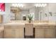 A bathroom featuring dual sinks, shower, separate soaking tub and large vanity mirror at 7003 S Irvington Ct, Aurora, CO 80016