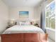 Bedroom with view through the windows, a bed and lamps on each side at 7003 S Irvington Ct, Aurora, CO 80016