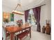 Traditional dining room showcasing a wooden table, elegant chandelier, and tasteful decor at 7003 S Irvington Ct, Aurora, CO 80016