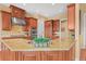 Spacious kitchen with granite countertops, stainless steel appliances, and custom cabinetry at 7003 S Irvington Ct, Aurora, CO 80016