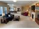 Spacious living room featuring a fireplace, pool table and cozy seating area at 7003 S Irvington Ct, Aurora, CO 80016