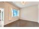 Bedroom with hardwood floors, a large window with natural light, and neutral-toned walls at 9422 E 58Th Pl, Denver, CO 80238