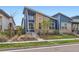 Striking modern home with a well-maintained front yard and unique architectural details at 9422 E 58Th Pl, Denver, CO 80238