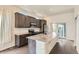 Modern kitchen with stainless steel appliances, granite countertops, and a large center island at 9422 E 58Th Pl, Denver, CO 80238
