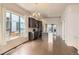 Open-concept kitchen featuring a center island, stainless steel appliances, and hardwood flooring at 9422 E 58Th Pl, Denver, CO 80238