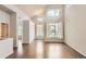 Spacious living room featuring high ceilings, ample natural light, and hardwood flooring at 9422 E 58Th Pl, Denver, CO 80238