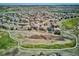 Beautiful aerial view of a suburban home with golf course views, a landscaped yard, and close proximity to other homes at 6971 S Netherland Way, Aurora, CO 80016