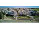 Back aerial view of home showcasing backyard with a deck and landscaping at 6971 S Netherland Way, Aurora, CO 80016