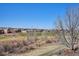 Scenic backyard view overlooking the golf course and neighborhood, offering serene outdoor living at 6971 S Netherland Way, Aurora, CO 80016