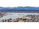 Scenic aerial shot overlooking a lake with mountains in the background and houses nearby at 3142 W 20Th Ave, Denver, CO 80211
