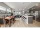 Bright, open concept living space with a kitchen island, dining area, and modern finishes at 3142 W 20Th Ave, Denver, CO 80211