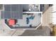Overhead aerial view of a rooftop deck with furniture and a red hot tub cover at 3142 W 20Th Ave, Denver, CO 80211