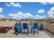 Rooftop deck featuring comfortable blue Adirondack chairs with views of the city skyline at 3142 W 20Th Ave, Denver, CO 80211