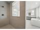Bright primary bathroom featuring glass shower, soaking tub, and double vanity at 3378 Backdrop Ct, Castle Rock, CO 80108