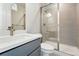 Bathroom featuring glass enclosed shower, gray vanity and white countertops at 3378 Backdrop Ct, Castle Rock, CO 80108