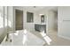 Bright primary bathroom featuring a glass shower and a soaking tub with modern fixtures at 3378 Backdrop Ct, Castle Rock, CO 80108