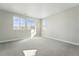 An empty bedroom with carpet and three windows allowing an abundance of natural light at 3378 Backdrop Ct, Castle Rock, CO 80108