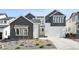 Two-story home featuring gray and white color scheme, landscaped front yard, and attached two-car garage at 3378 Backdrop Ct, Castle Rock, CO 80108