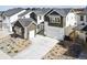 A beautifully designed two-story home with a three car garage and landscaped front yard at 3378 Backdrop Ct, Castle Rock, CO 80108