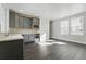 Eat in kitchen with gray cabinets, a wine cooler and sleek countertop at 3378 Backdrop Ct, Castle Rock, CO 80108