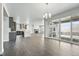 Bright and airy living space connecting the kitchen, living room, and outdoor area, perfect for entertaining at 3378 Backdrop Ct, Castle Rock, CO 80108