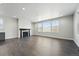 Living room featuring a modern fireplace and large windows offering plenty of natural light and a view at 3378 Backdrop Ct, Castle Rock, CO 80108