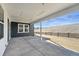 Covered patio showcasing a concrete floor and a backyard view with wooden fence at 3378 Backdrop Ct, Castle Rock, CO 80108