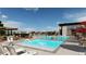Community pool with several lounge chairs, tables, sunshades, and fountains at 3378 Backdrop Ct, Castle Rock, CO 80108