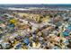 Expansive aerial view of a suburban neighborhood near a park and distant city skyline at 6306 Xavier St, Arvada, CO 80003