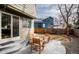 Backyard patio with light gray pavers and a charming outdoor seating area at 6306 Xavier St, Arvada, CO 80003