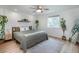 Serene bedroom featuring a queen-size bed, plants, neutral colors and natural light at 6306 Xavier St, Arvada, CO 80003