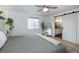 Well-lit bedroom featuring a queen-size bed and a bathroom view through a sliding door at 6306 Xavier St, Arvada, CO 80003