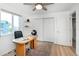 Bright office space with a ceiling fan, featuring a large window and ample closet space at 6306 Xavier St, Arvada, CO 80003