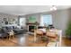 Inviting living room with hardwood floors, fireplace, and a neutral color scheme at 6306 Xavier St, Arvada, CO 80003
