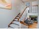 View of the staircase leading to an upper level with a cozy living area at 6306 Xavier St, Arvada, CO 80003