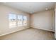 Bright bedroom featuring three large windows at 8606 Hotchkiss St, Littleton, CO 80125