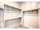 Walk-in closet with ample shelving at 8606 Hotchkiss St, Littleton, CO 80125
