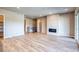 Spacious living room with a modern fireplace and beautiful floors at 8606 Hotchkiss St, Littleton, CO 80125