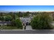 Aerial view of an elegant home with lush landscaping and mountain views in the background at 115 S Glencoe, Denver, CO 80246