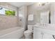 Bathroom with a tub and shower combo, white marble tile surround, and white vanity with marble countertop at 115 S Glencoe, Denver, CO 80246