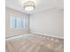 Bedroom with neutral walls, broadloom carpeting, and a bright window at 115 S Glencoe, Denver, CO 80246