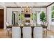 Open dining area with chandelier and access to outdoor space through sliding doors at 115 S Glencoe, Denver, CO 80246