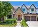 Charming stone and stucco home with manicured landscaping and an arched entryway at 115 S Glencoe, Denver, CO 80246