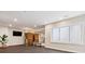 Spacious home gym featuring a large window, mirrored wall, and rubber flooring at 115 S Glencoe, Denver, CO 80246