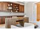 Office with custom built-in cabinets and a large wooden desk with view of the doorway at 115 S Glencoe, Denver, CO 80246